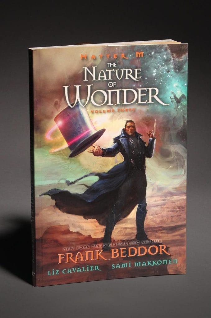 The paperback edition photographed against a grey backdrop.