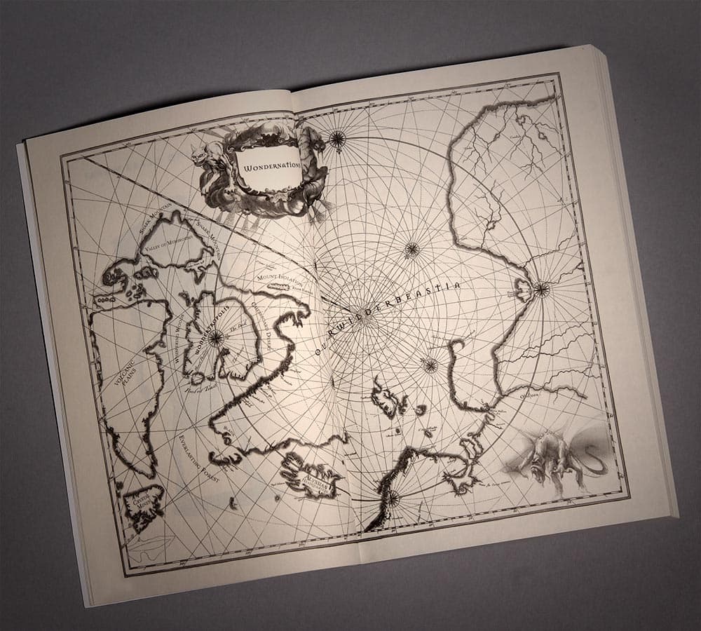 An interior spread showing an engraved map of Wondernation across both pages.