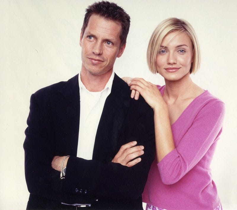 Frank Beddor and Cameron Diaz in a press portrait for There&rsquo;s Something About Mary, her hand on his shoulder against a plain backdrop.