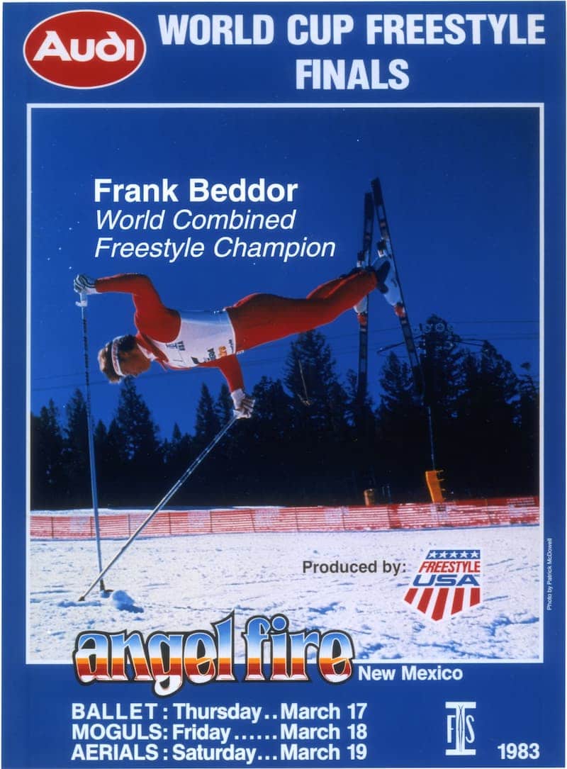 An event poster for the 1983 Audi World Cup Freestyle Finals
               at Angel Fire, New Mexico. A photograph of Beddor holding a
               one-armed handstand on his poles in a red suit fills it, captioned
               &ldquo;Frank Beddor, World Combined Freestyle Champion&rdquo;, with
               the ballet, moguls and aerials dates listed underneath.