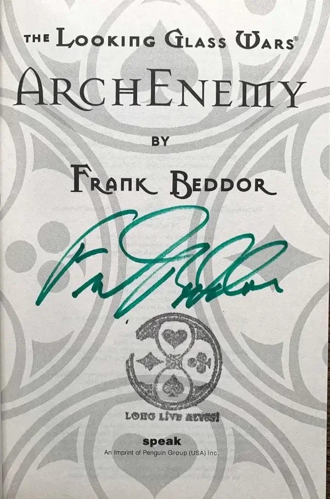 The title page signed in green ink by Frank Beddor above a Wonderland seal reading “Long live Alyss”.