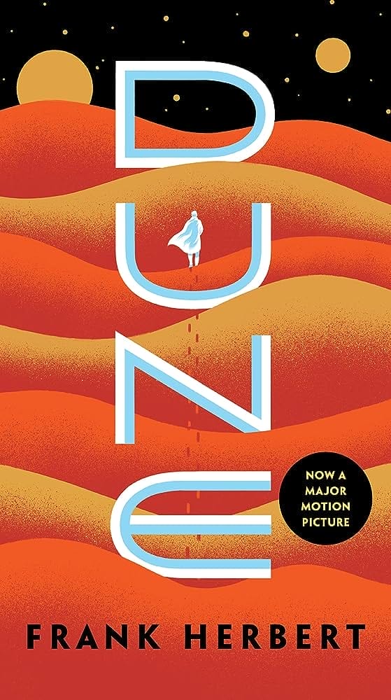 Book Cover for Frank Herbert's "Dune", featuring a cartoonish night sky, with 2 moons and multiple waves of sandy dunes in red, yellow and orange hues. 