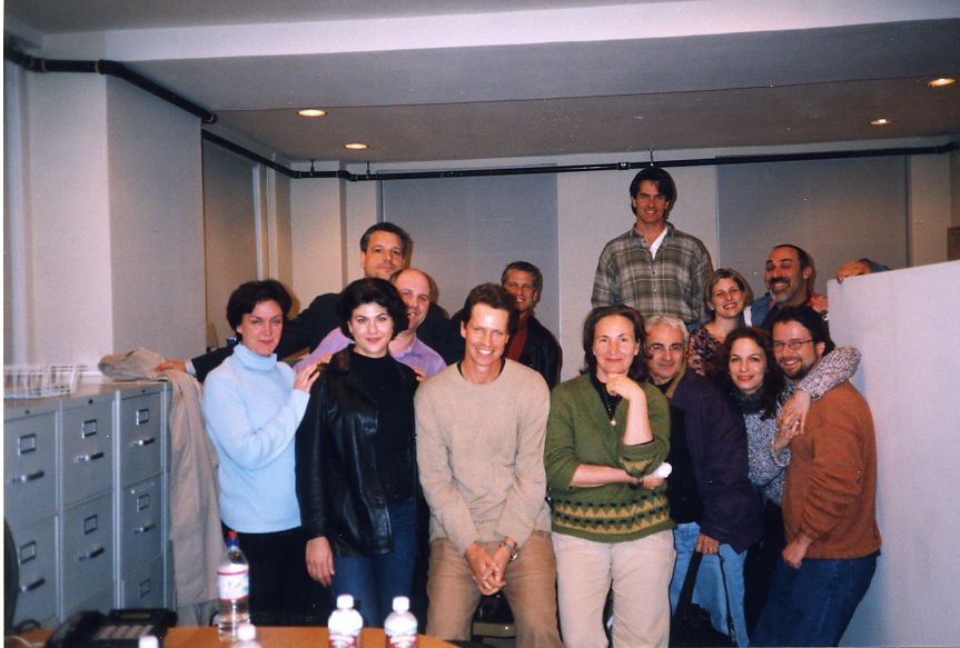 A dozen people crowded together for a photograph in an
                    office after a script reading. Frank Beddor is at the front
                    in a pale sweater; Liz Cavalier stands beside him in a
                    green sweater, chin on her hand.