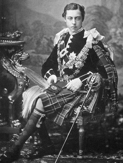 Photograph of Prince Leopold, Duke of Albany, son of Queen Victoria, sitting in a chair and wearing a kilt and livery collars, taken by W&D Downey photographers in 1872.