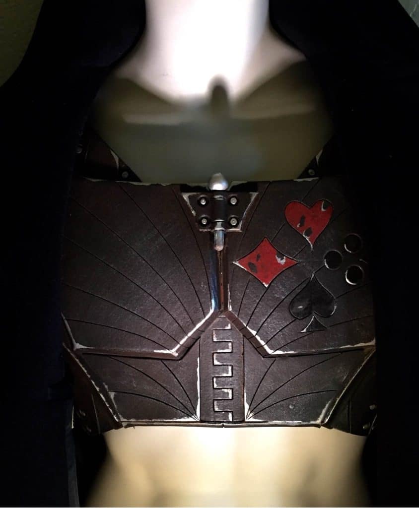 In the photo Hatter Madigan's chest armor for his costume is cinematically lit from below as it sits on a mannequin.