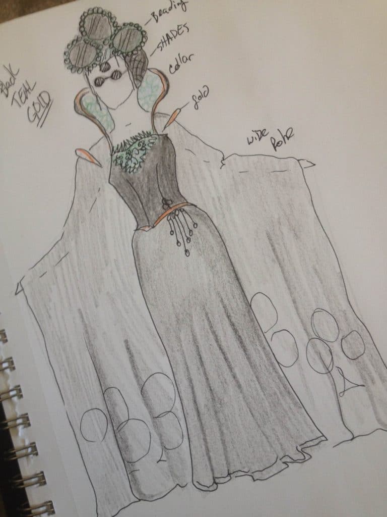 Drawing of a costume for the Queen of Clubs by Chad Evett highlights a head piece and gown in black and turquoise.