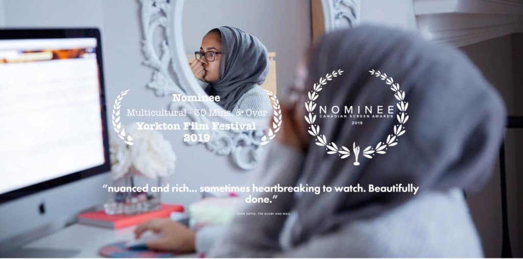 a muslim woman sits in front of a computer looking tense or worried, Wendy Rowland's 14 and Muslim 2019