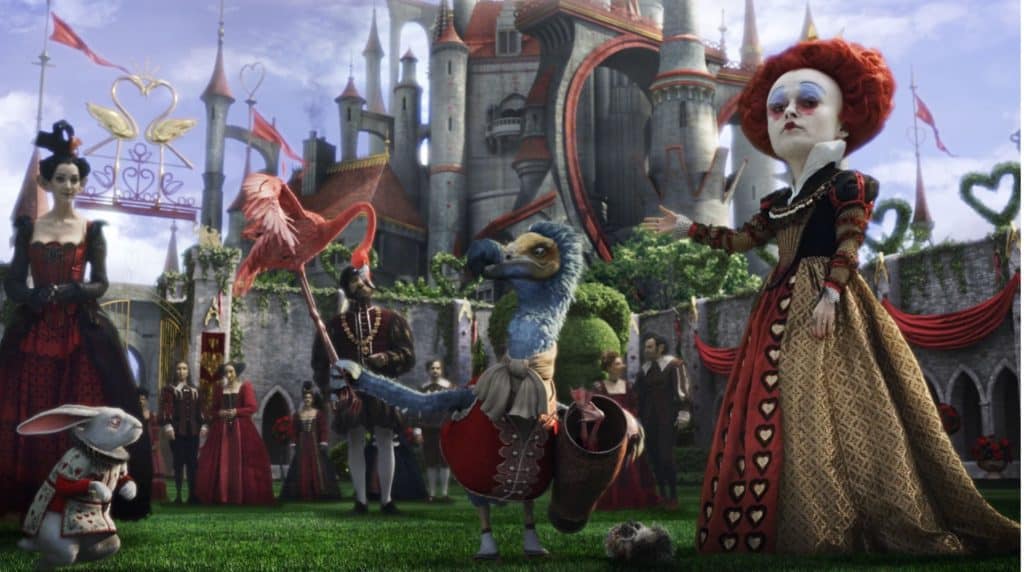 Image of the Red Queen, standing in her courtyard, from Tim Burton's Alice In Wonderland, as played by Helena Bonham Carter.