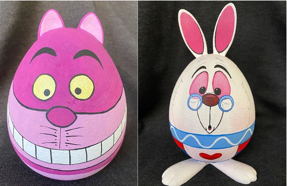 Painted eggs of the Cheshire Cat and White Rabbit created by Ray Brown