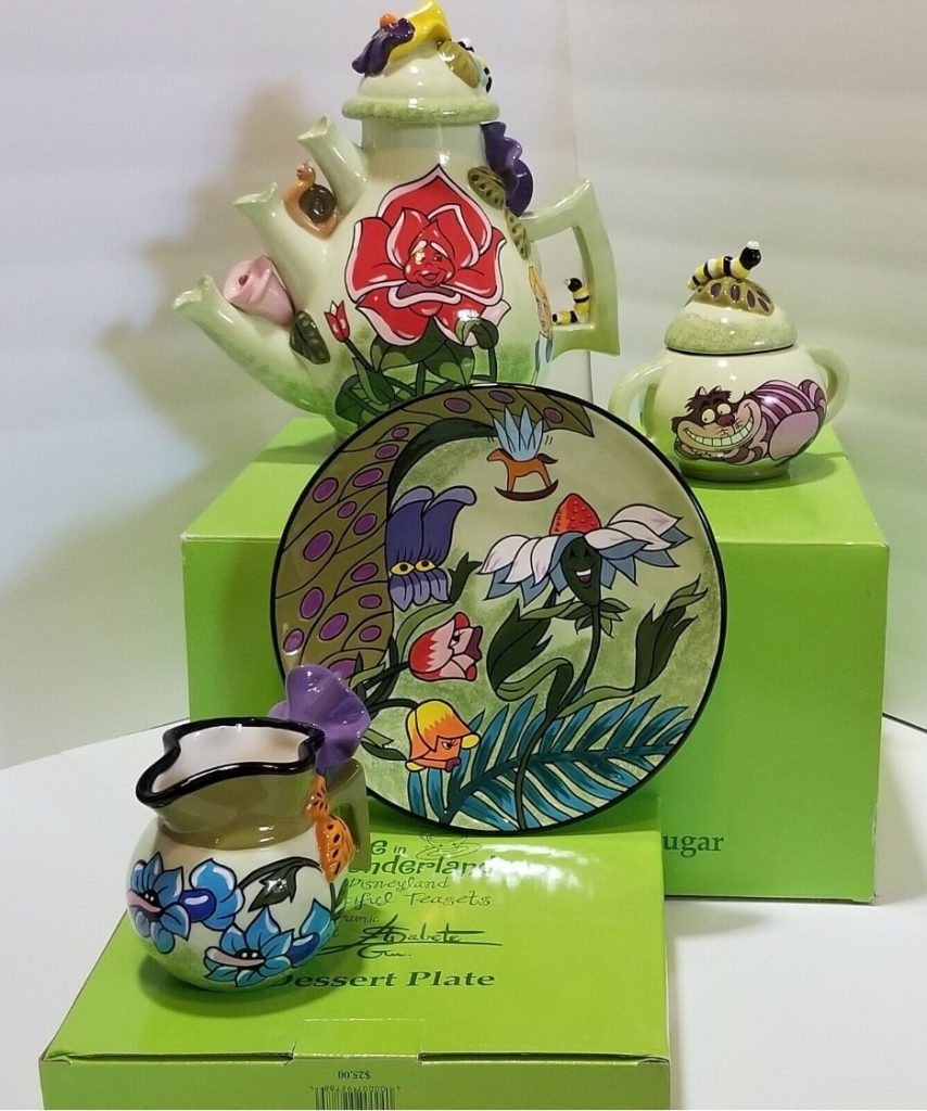 Disney-Alice-in-Wonderland-tea-set-teapot-cups-plates-sugar-bowl-extremely-rare-collectors-item-centerpiece-of-tea-table-mad-hatter's-tea-party-hard-to-find-classic-Disney-animation-accents-on-trii-spout-tea-pot-and-accessories-flowers-Chesire-Cat-caterpillar-singing-flower-Disneyland-memorabilia-by-Elisabete-Gomes