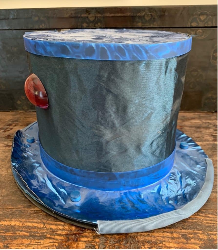 blue-top-hat-with-a-red-button-on-the-side-for-mad-hatter-cosplay-Hatter-Madigan-Alice-in-Wonderland-SDCC-2023-cosplay-ideas-how-to-create-a-costume-from-scratch