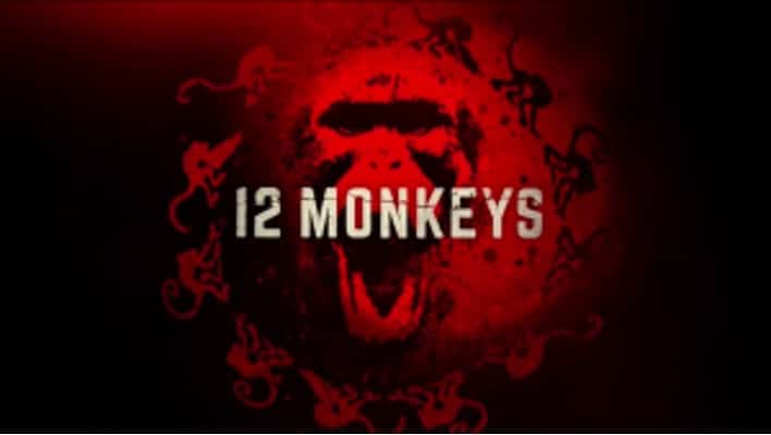 12 Monkeys television series logo, with the words in off-white in front of a dark red monkey face logo with 12 monkeys dancing around it in a circle. 
