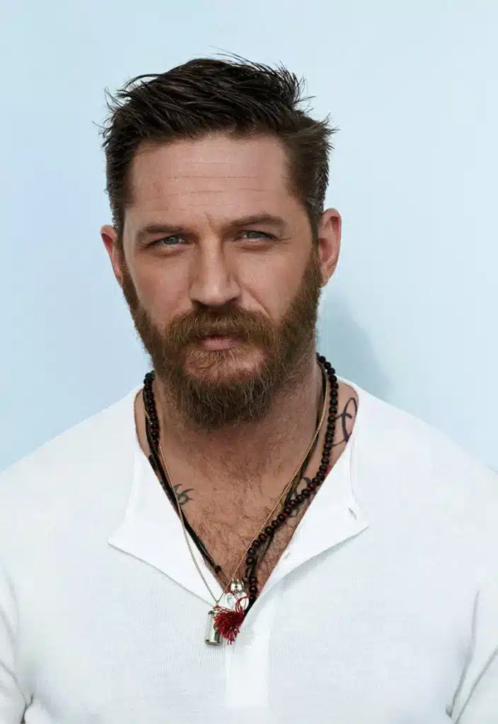 Image of Tom Hardy, a British actor known for his roles in Christopher Nolan's The Dark Knight Rises, Inception, Dunkirk, and Marvel Comics' Venom. Could he portray Hatter Madigan in a television adaptation of The Looking Glass Wars, by Frank Beddor? 