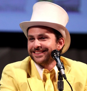 Image of American actor and comedian, Charlie Day in a yellow suit and white hat, portraying the character: Day Man at SDCC. Could he be the White Knight in Alice in Wonderland?