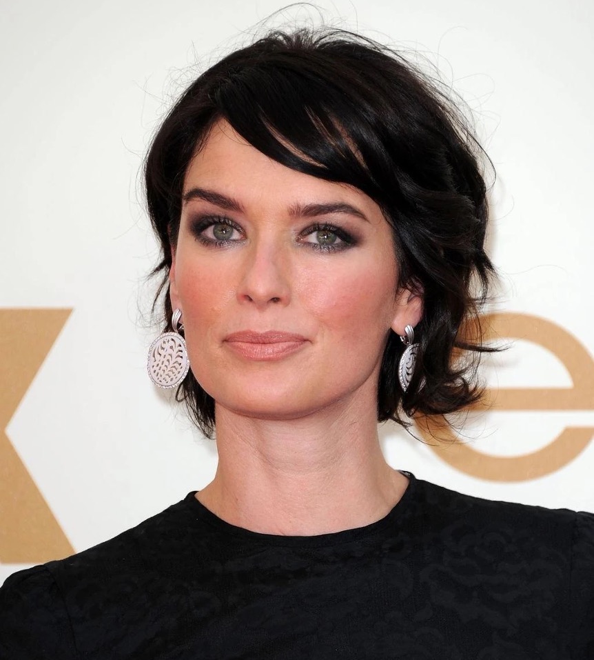 Image of American Actress, Cersei Lannister, with dark hair wearing earrings and a black dress. Could she be the Queen of Hearts in a remake of 1999's Alice in Wonderland? 