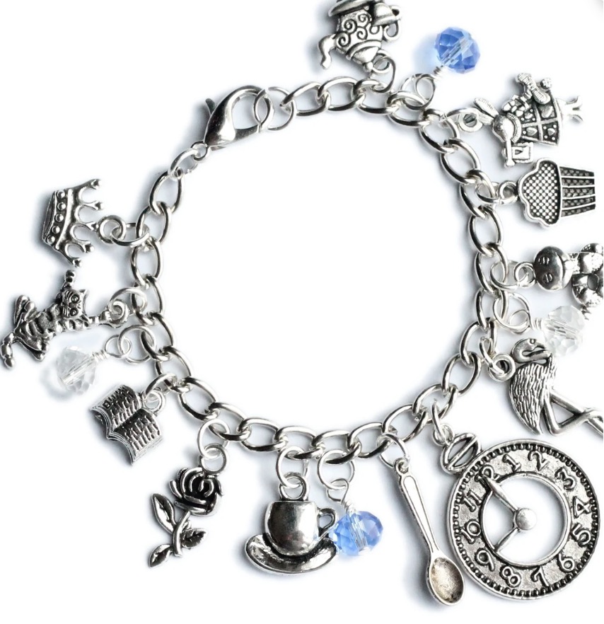 Charm bracelet featuring the white rabbit and flamingos and tea pots and other wonderland icons