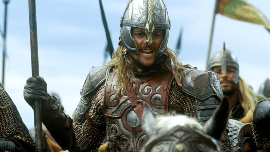 Karl Urban as Eomer in "The Lord of the Rings: The Two Towers" atop a horse, wearing armor, and holding a spear