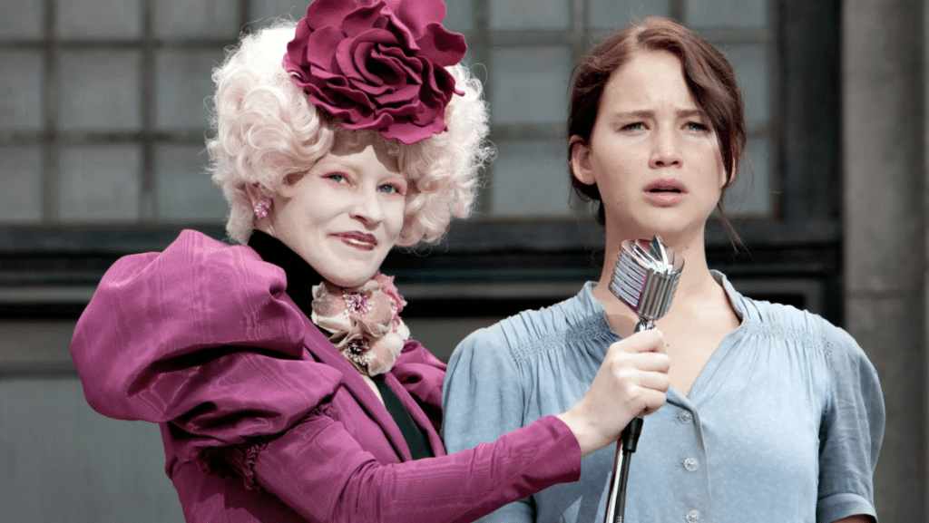 Elizabeth Banks as Effie Trinket and Jennifer Lawrence as Katniss Everdeen in "The Hunger Games". 
