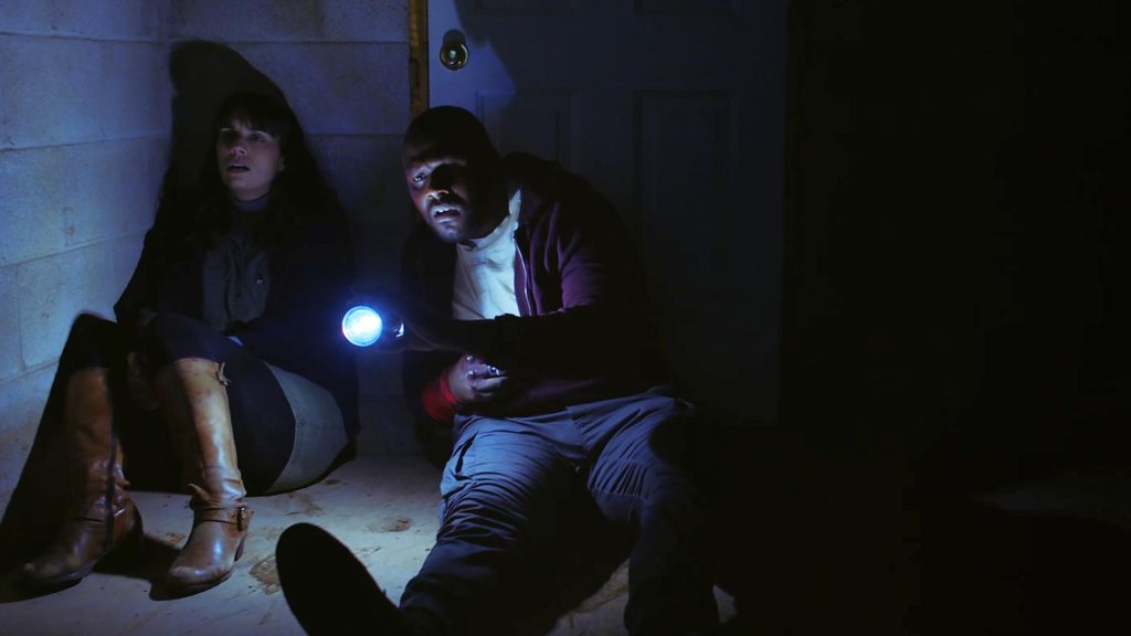 Adrienne Kress and Ryan Allen in the 2023 horror film "The Devil Comes at Night". 