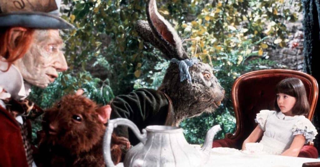 Still image from the 1985 film "Dreamchild" featuring Alice, the March Hare, and the Mad Hatter.