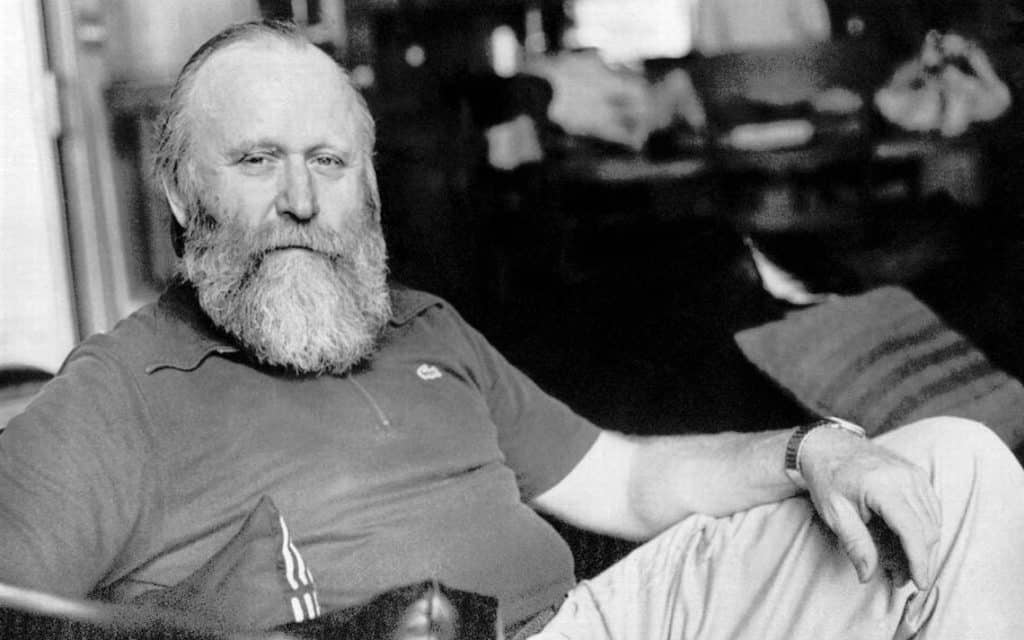Frank Herbert, author of science fiction novel "Dune", reclines in a chair in his home office.