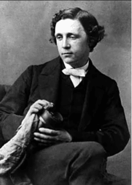 Image of “Alice’s Adventures in Wonderland” author Lewis Carroll sitting in a chair with his legs crossed.