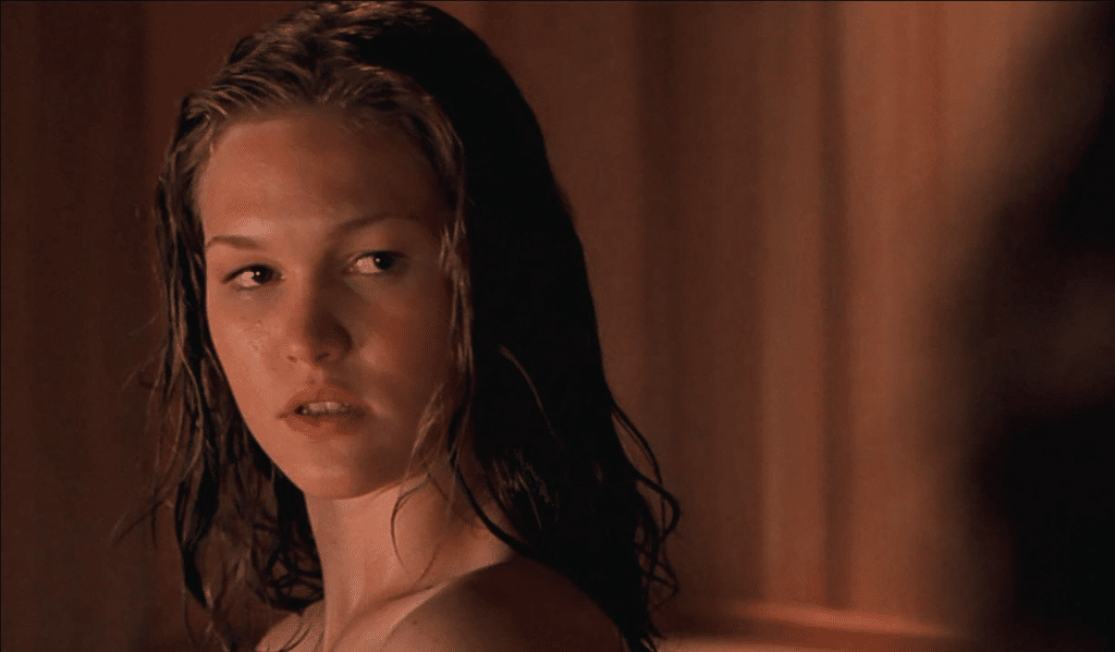 Still image of Julia Stiles in a sauna from the 2001 drama film "The Business of Strangers". 