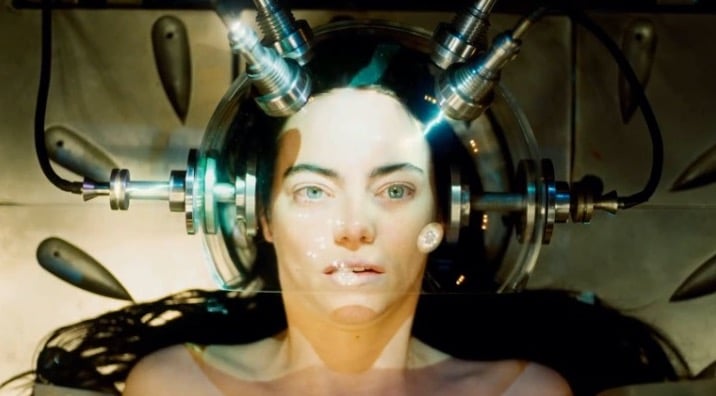 Still image of Emma Stone as Bella Baxter with a glass bubble over her head from Yorgos Lanthimos' "Poor Things". 