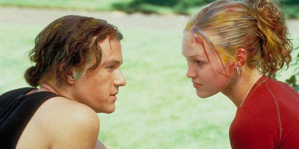 Still image of Julia Stiles and Heath Ledger covered in paint from the 1999 teen romantic comedy film "10 Things I Hate About You". 