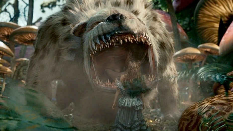 Still image of the bandersnatch roaring at Mia Wasikowska as Alice Kingsleigh in Tim Burton's 2010 period adventure fantasy film "Alice in Wonderland".