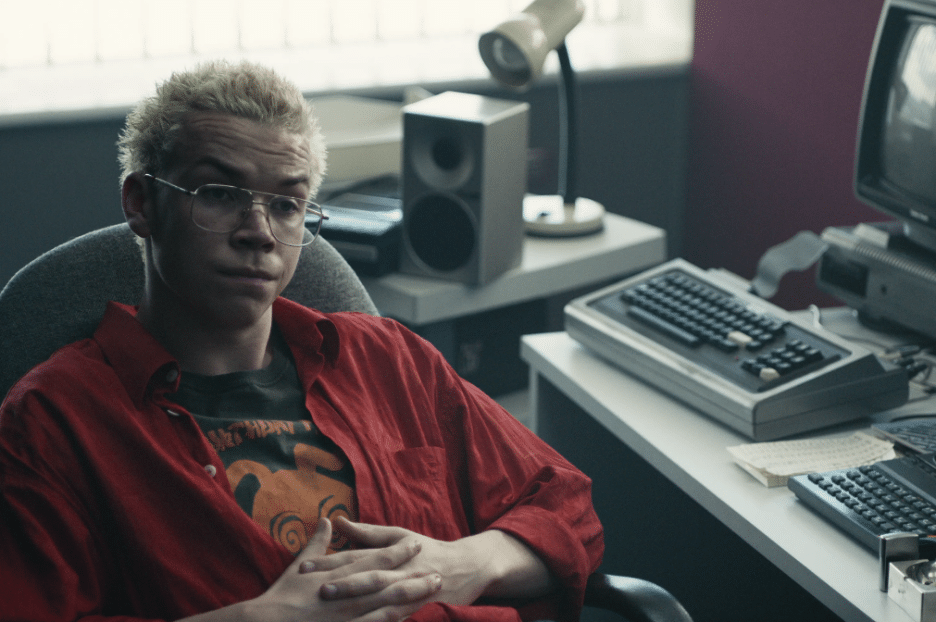 Still image of Will Poulter as Colin Ritman from the Netflix science fiction interactive film "Black Mirror: Bandersnatch".