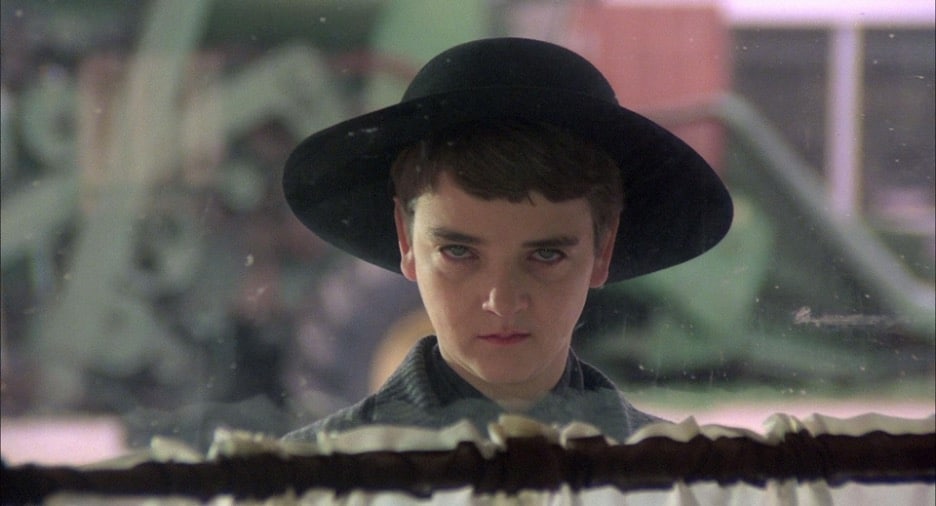 Still image of John Franklin as Isaac Chroner in the 1984 supernatural horror film "Children of the Corn". 