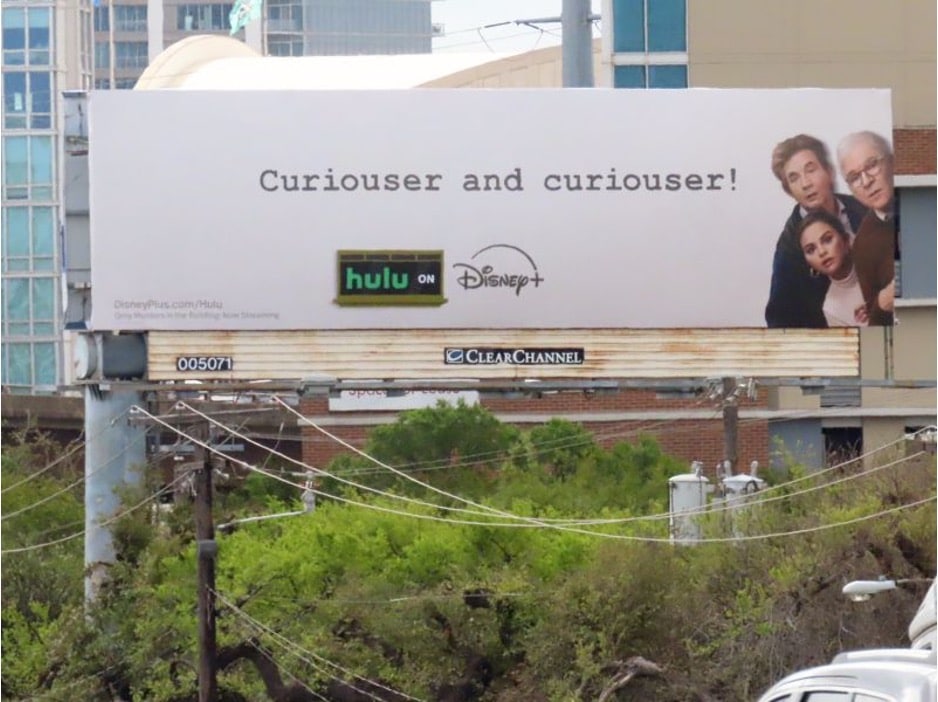 Disney Plus and Hulu billboard featuring Martin Short, Selena Gomez, and Steve Martin from the Hulu mystery comedy-drama series "Only Murders in the Building".