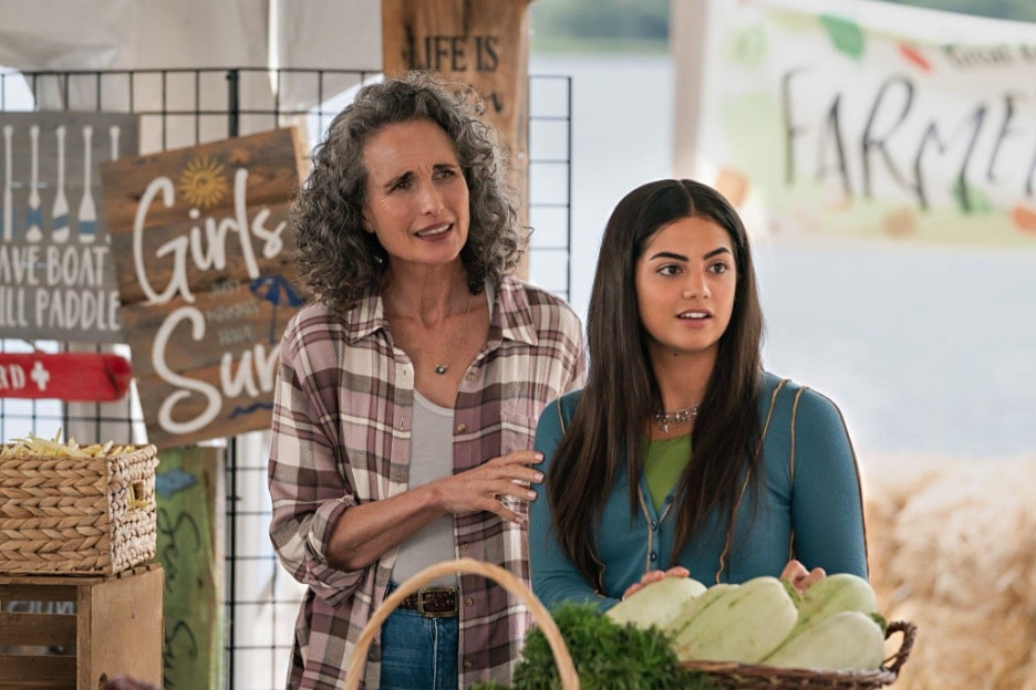A still image from the Hallmark Channel original series "The Way Home" featuring Andie MacDowell as Del and Sadie Laflamme-Snow as Alice at a farmers market. 