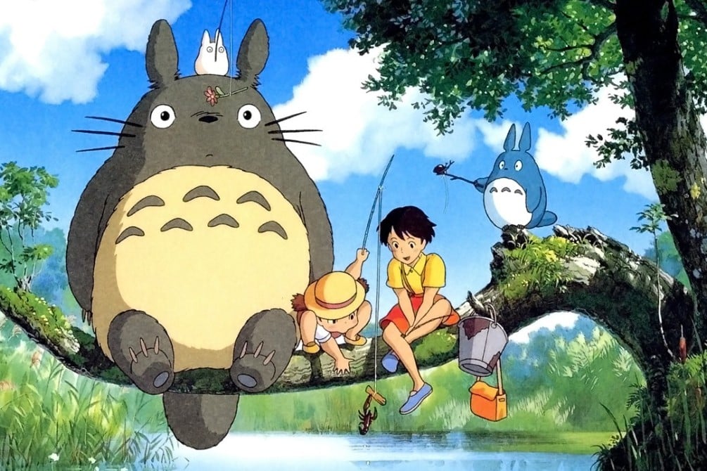 Still image of Totoro, Satsuki, Mei, and two other spirits from the 1988 Japanese animated film "My Neighbor Totoro," directed by Hayao Miyazaki. 