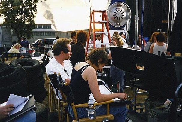 Picture of script supervisor Dina Waxman with director David Fincher sitting in front of the monitor on the set of the 1999 film "Fight Club". 
