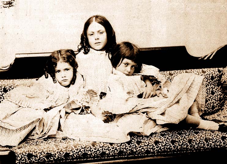 An 1859 photograph by Lewis Carroll of Alice Liddell (right) with her older sister Lorina (middle) and younger sister Edith (left). 