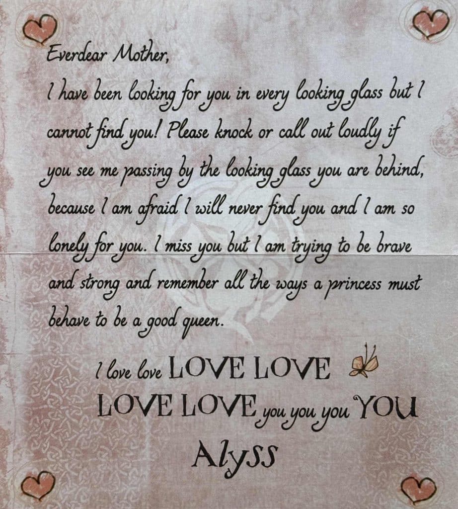 A letter written from Princess Alyss Heart to her mother Queen Genevieve on pale pink paper and decorated with red hearts in each corner. 