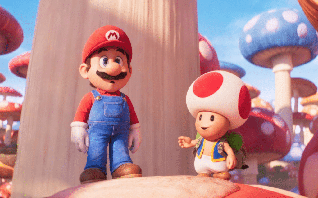 Image from the 2023 animated adventure comedy film "The Super Mario Bros. Movie" featuring Mario and Toad in a multi-colored mushroom forest.