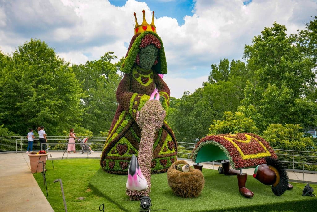 A topiary sculpture depicting the Queen of Hearts playing croquet from "Alice in Wonderland" in the Atlanta Botanical Garden.