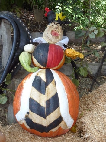 A multi-pumpkin art installation depicting the Queen of Hearts from "Alice in Wonderland".