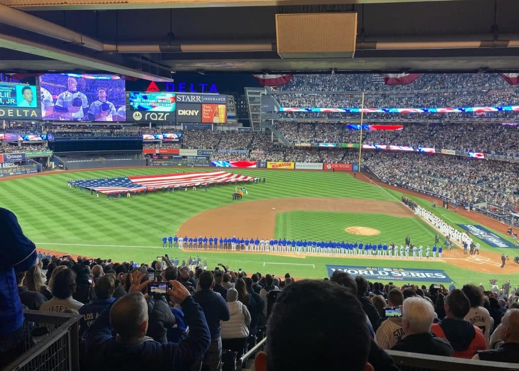 A photograph of the field during the national anthem at Yankee Stadium before Game 3 of the 2024 World Series. 